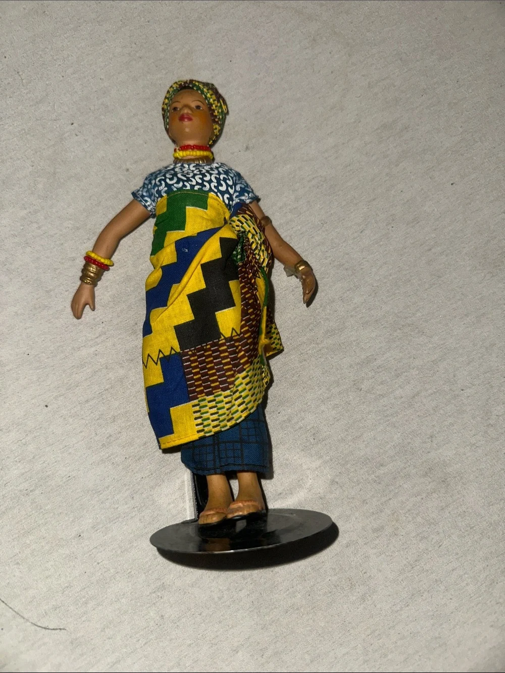 Handmade African Cloth Porcelain Doll in Vibrant Yellow, Blue & Green